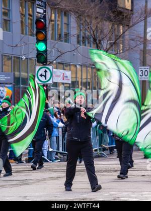 Montreal, Canada - March 17 2024： People celebrating the Saint Patrick`s Day Parade in Montreal downtown Stock Photo